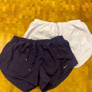 Nike running shorts. Lilac and plum. Draw string. Back pocket. Size large
